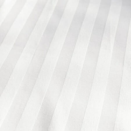 Satin stripes in white, presented at an angle to show how light affects the design.