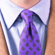 A blue dress shirt with purple paisley tie from Fort Belvedere