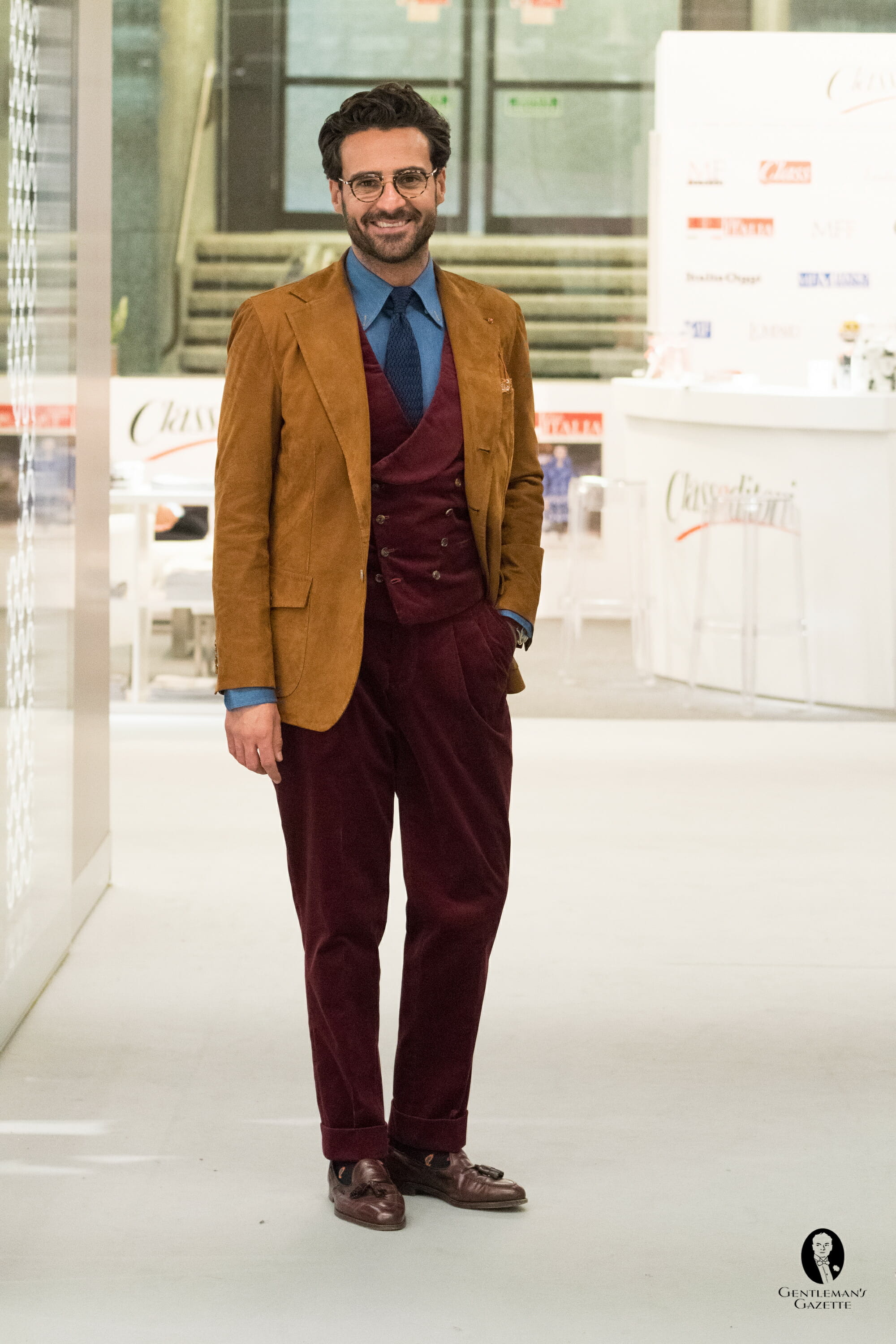 Corduroy vest and trousers paired with tassel loafers and a suede jacket