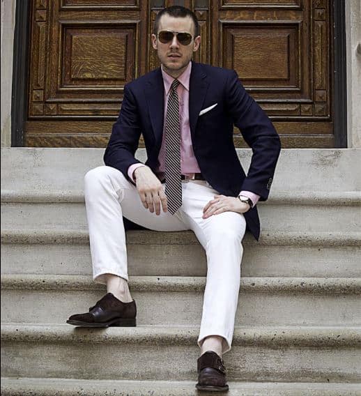 Cream trousers worn with blue and pink