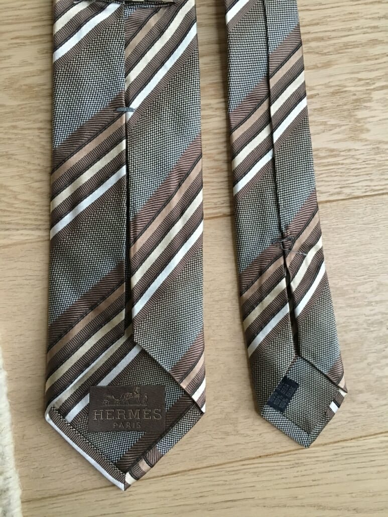 Fake woven Hermes Tie with thick bar tacks and hermes label woven into the lining