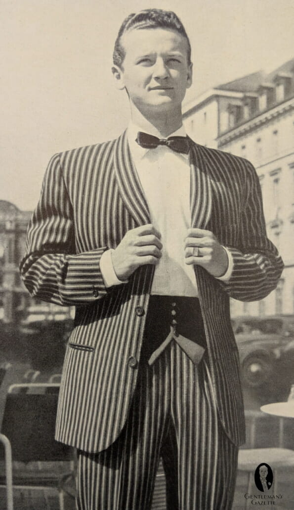 1960s French take on a striped tuxeowith shawl collar and cummervest, which can be buttoned in the middle