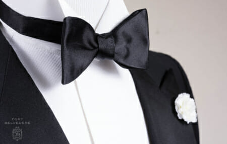 Black Bow Tie in Silk Satin and White Carnation Silk Boutonniere Fort Belvedere