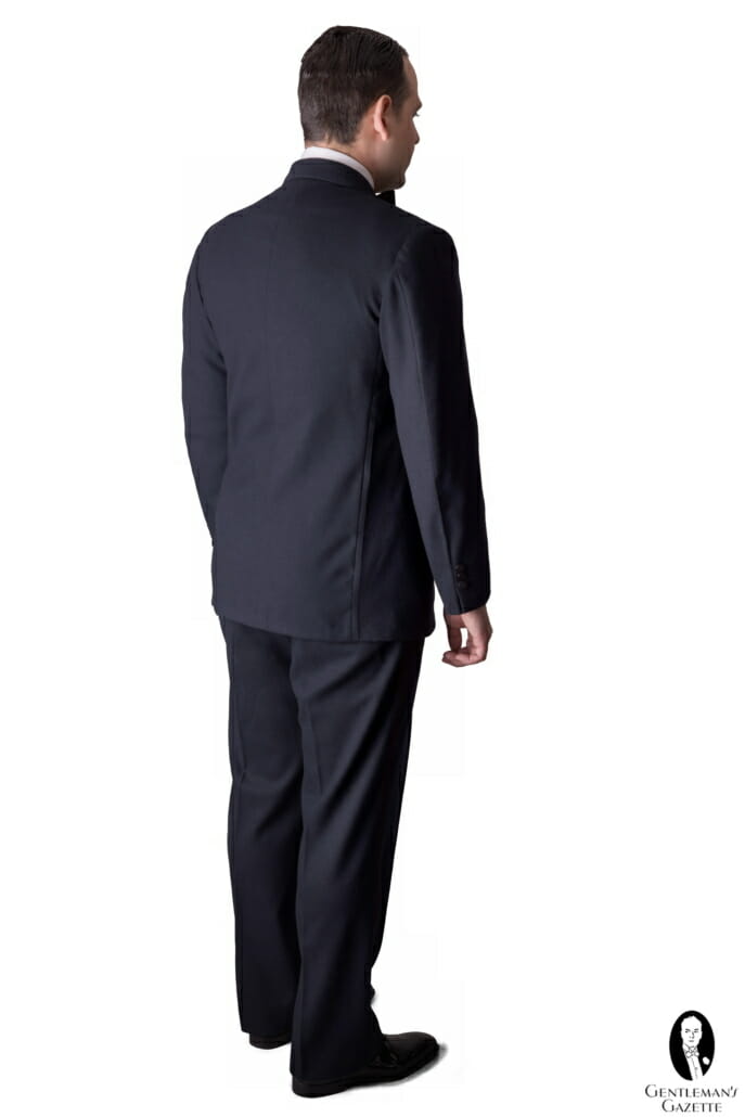 The reverse of the same ensemble; note that the jacket has no rear vents.