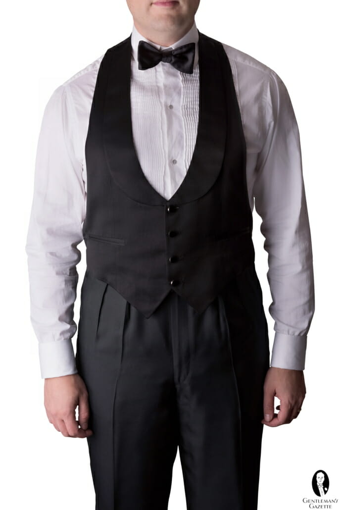Raphael wearing a formal waistcoat that serves to elegantly frame the shirtfront and hide the trouser waistband.