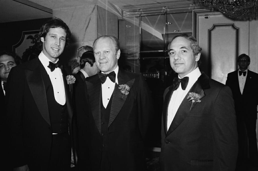 Chevy Chase, Gerald Ford andRon Nessen on March 25, 1976 Note the big bow ties and whide lapels. Neeson has a velvet collar and notched lapels