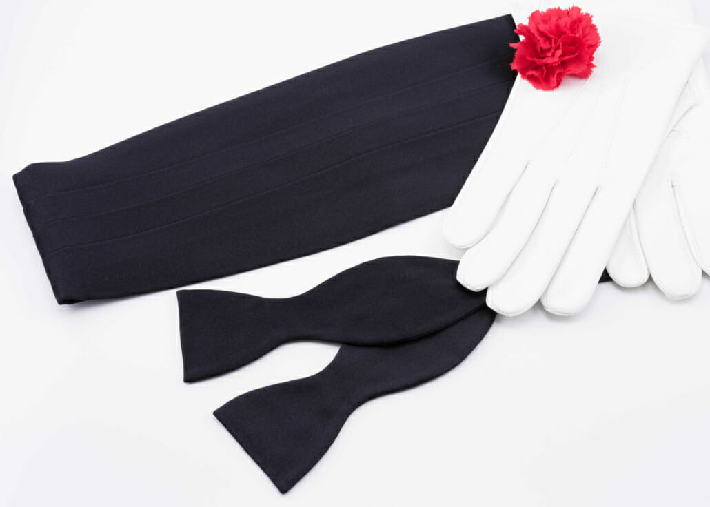 Cummerbund in Black Silk Satin with Black Silk Satin Bow Tie and White Unlined Leather Gloves and Red Carnation Boutonniere