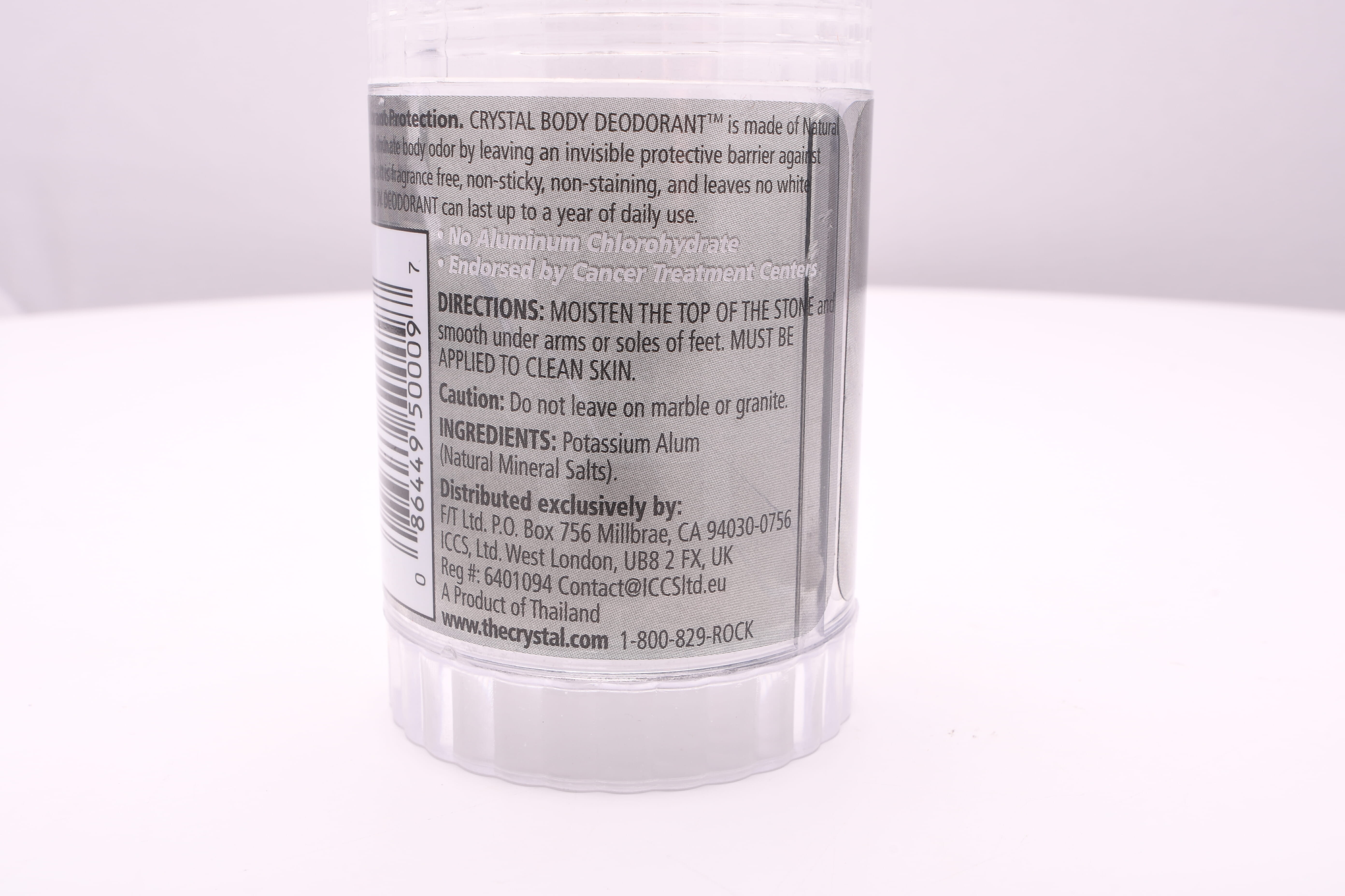 The backside of the crystal deodorant, noting that its principal ingredient is potassium alum.