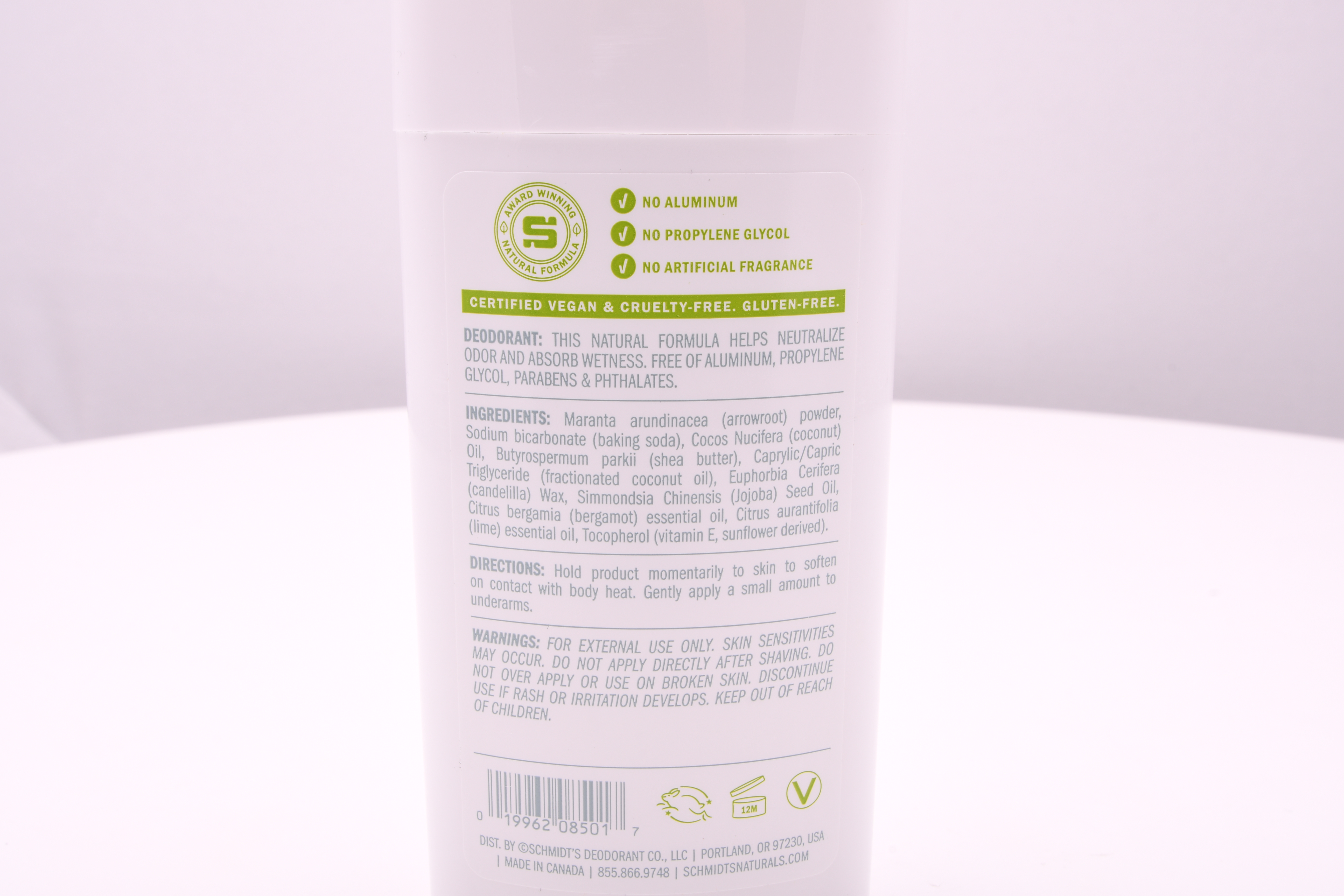 The backside of the natural deodorant, listing its ingredients and processes.
