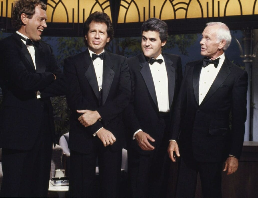 David Letterman, Garry Shandling, Jay Leno, Johnny Carson all in notched lapel tuxedos in 1988