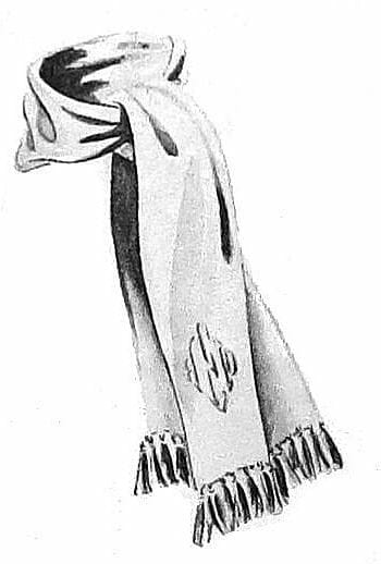 Esquire suggested that dress mufflers be tied ascot style and have a monogram. (1940)