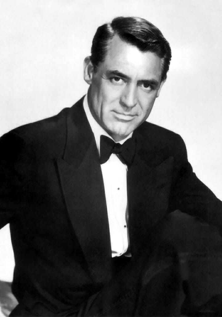 Cary Grant with wide peak lapel tuxedo and butterfly bow tie and two shirt studs