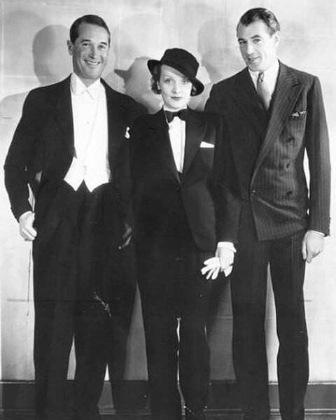 Maurice Chevalier in white tie, Marlene Dietrich in Black Tie and Gary Cooper in striped 6x1 suit