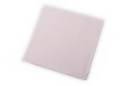 A plain white linen pocket square on a white background