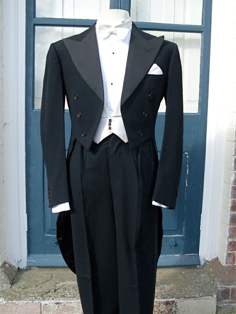 White tie dress suit by Huntsman 1948 with dark studs and matching waistcoat buttons