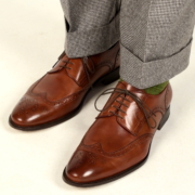 Brown calf leather full brogue Wingtips by Ace Marks paired with houndstooth suit and brown and green shadow stripe socks from Fort Belvedere