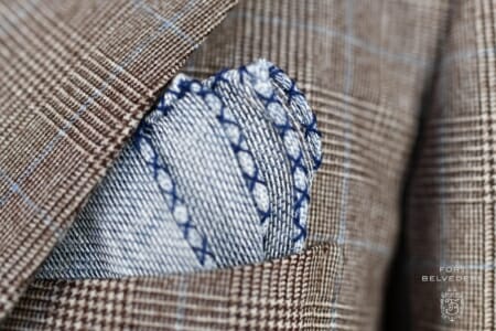 A photo of a Dark Blue Handcrafted Linen Pocket Square with Navy Blue Handrolled X Stitch - Fort Belvedere