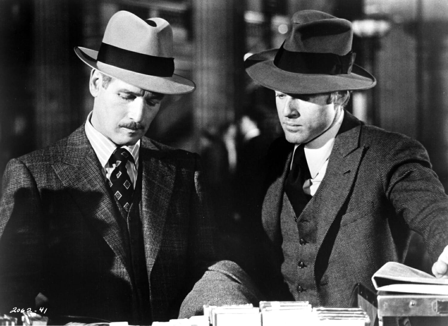 Paul Newman (L) and Robert Redford in 1973's The Sting. Note the 1930's costumes, including fedoras and suits with checks and patterns.