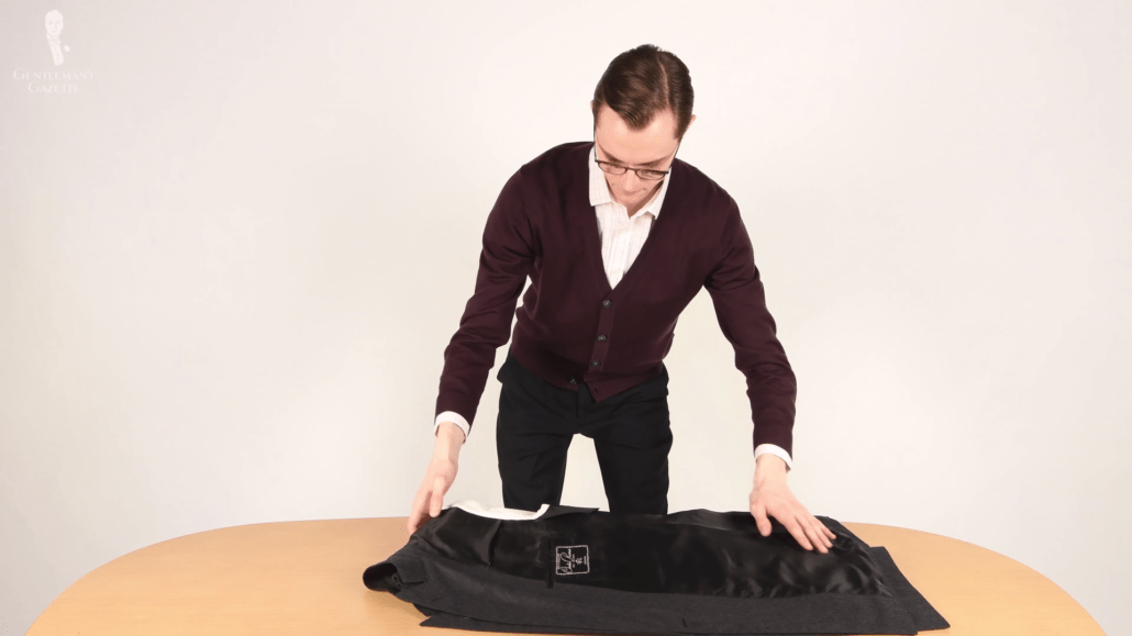 Preston Schlueter folding a jacket