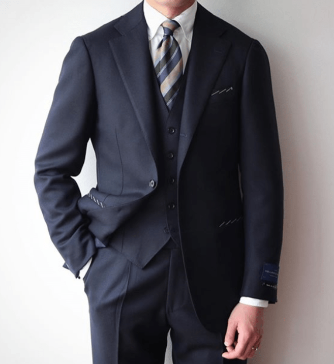 A three-piece suit with pleated pants