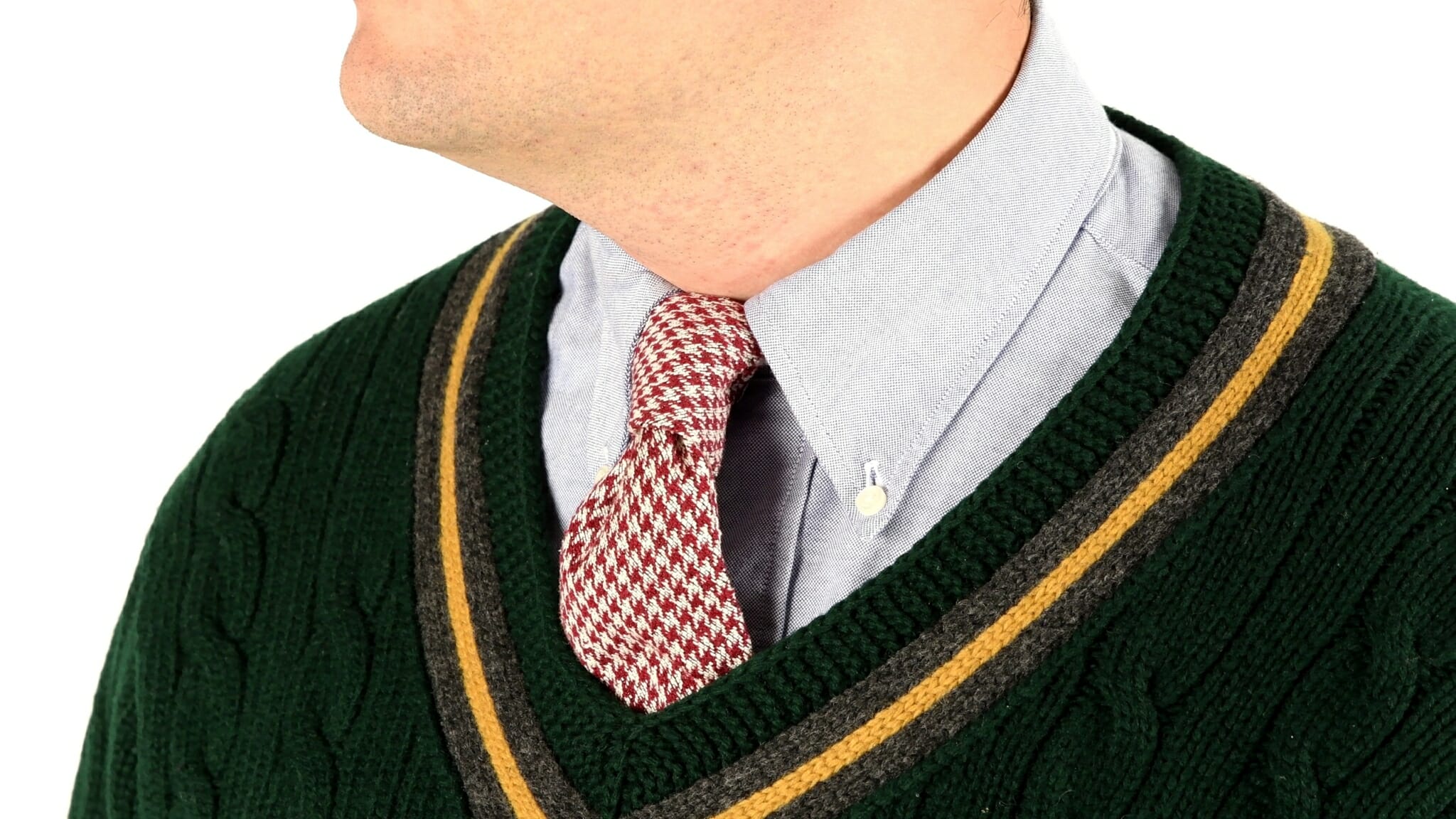 OCBD collar shirt with a green tennis sweater and a houndstooth tie