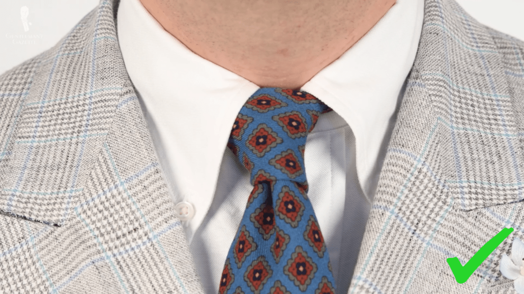 Full Windsor knot with a button-down collar