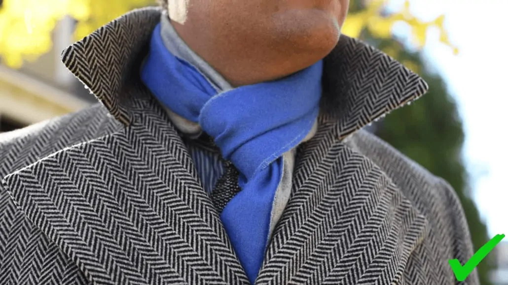 A patterned overcoat with a solid colored scarf from Fort Belvedere