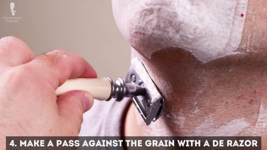 Make a pass against the grain with a DE razor for a smoother finish.