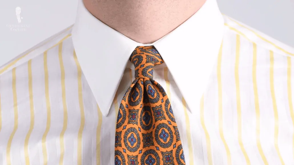 An Oriental knot, shown here with the Wool Challis Tie in Sunflower Yellow with Green, Blue and Red Pattern from Fort Belvedere