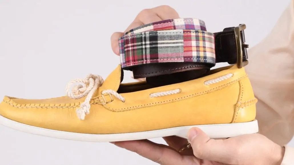 Two Prep style staples: a Madras-patterned belt and yellow boat shoes