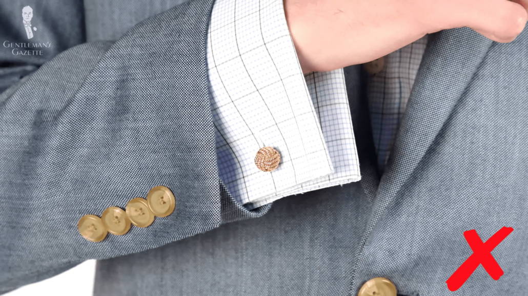 Shirt cuff sticking out of a jacket sleeve