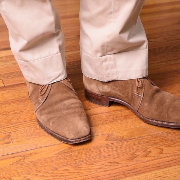 Traditional khaki colored chinos worn with light tan chukka boots