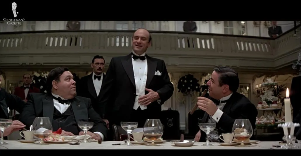 Robert De Niro as Al Capone (center) in a black-tie ensemble