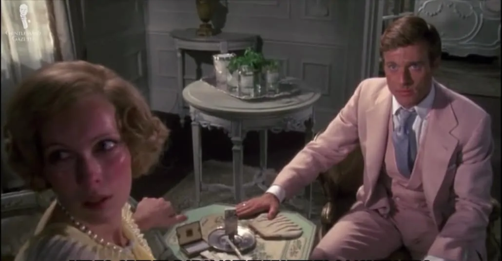 Robert Redford as Gatsby in the character's signature pink suit.