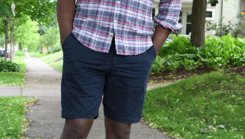 Kyle wearing a pair of navy 9-inch shorts.