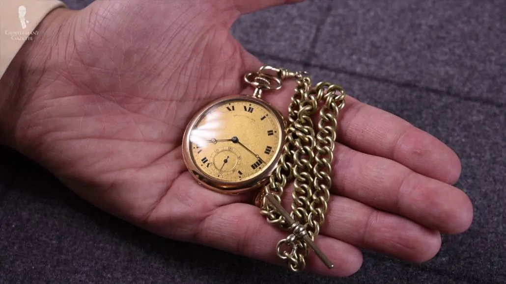 A pocket watch with an Albert chain. 