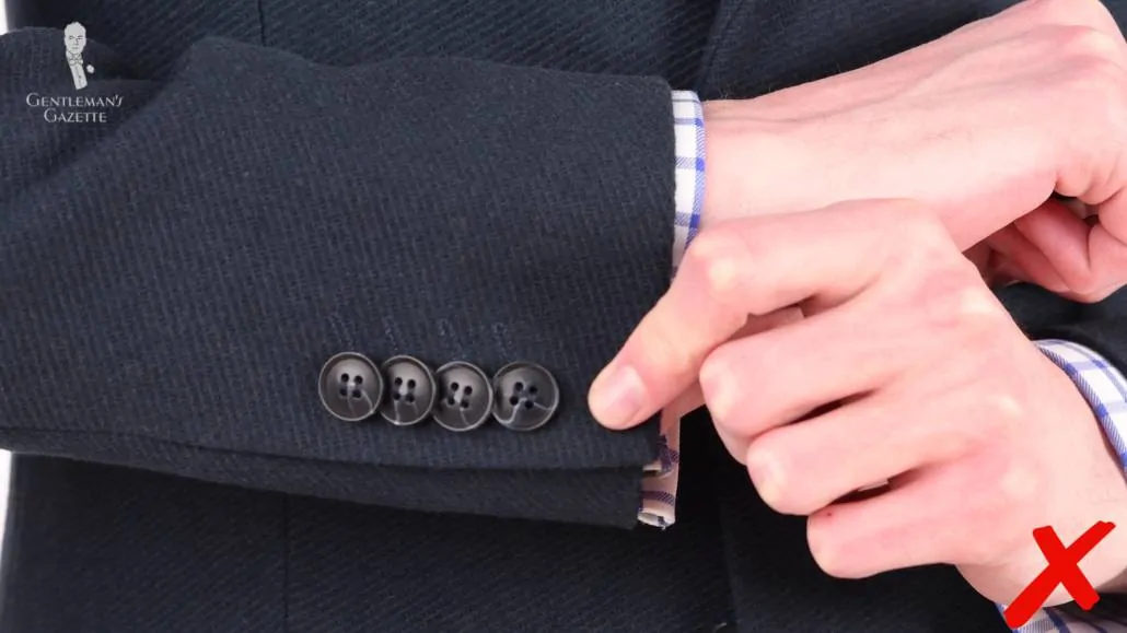 There are four kissing buttons on the sleeves with just a faint suggestion of buttonholes.