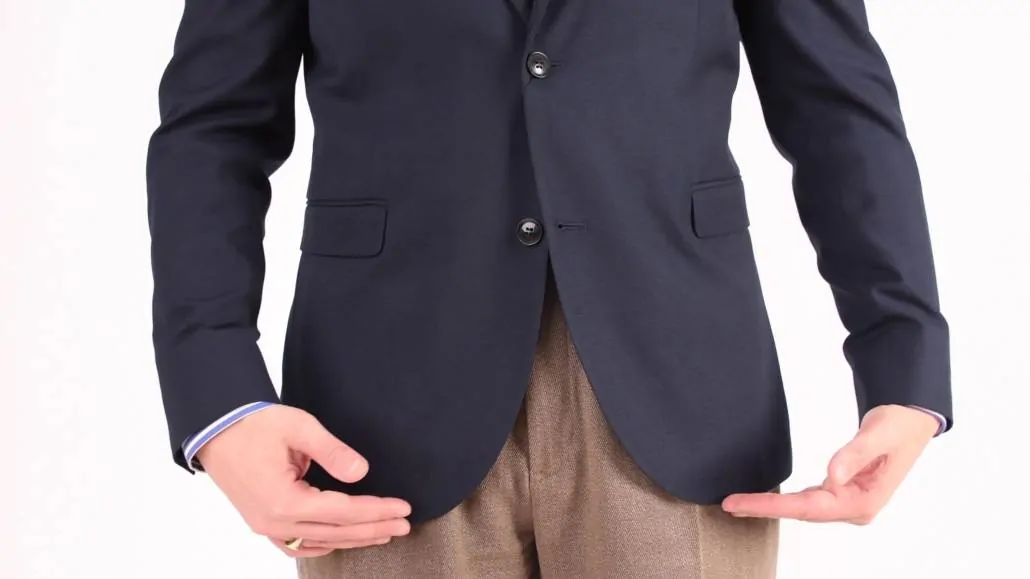 A navy jacket with rounded quarters.
