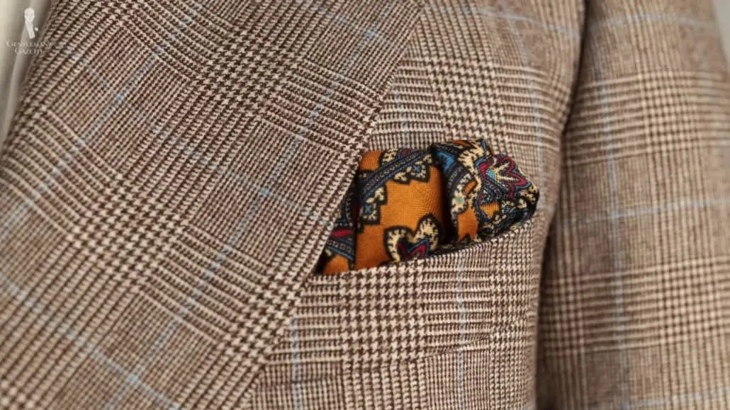 Antique Gold Yellow Silk Wool Pocket Square with Paisley paired with a Prince of Wales check jacket