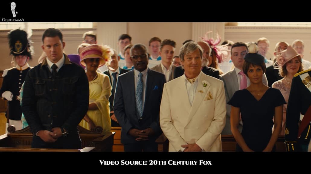 Agent Champagne wearing a double-breasted ivory suit at Eggsy's wedding.