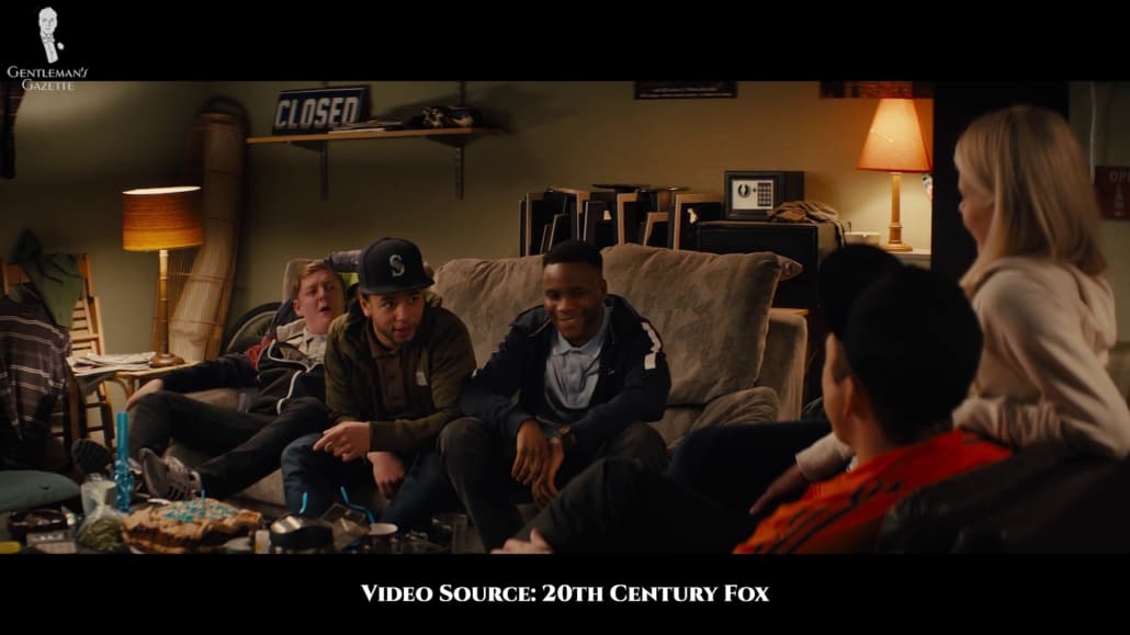 Eggsy's friends who are usually in street wear are seen later in the film wearing suits with carnation boutonnieres.