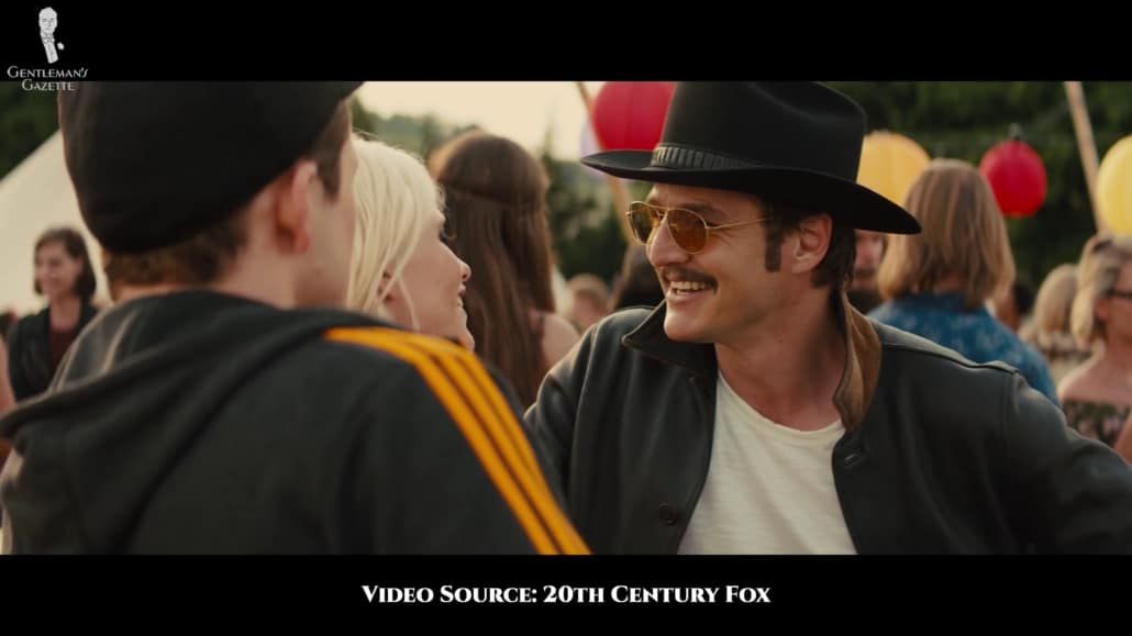 Agent Whiskey sporting a black leather jacket and a white t-shirt. 