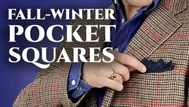 Cover showing a close up of Raphael's denim blue shirt, houndstooth jacket, and Wool Challis Pocket Square in Navy with Blue Polka Dots from Fort Belvedere