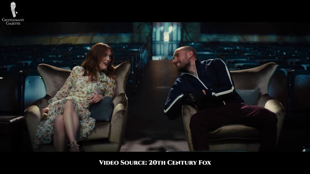 Poppy Adams in a floral dress with matching high heels. 