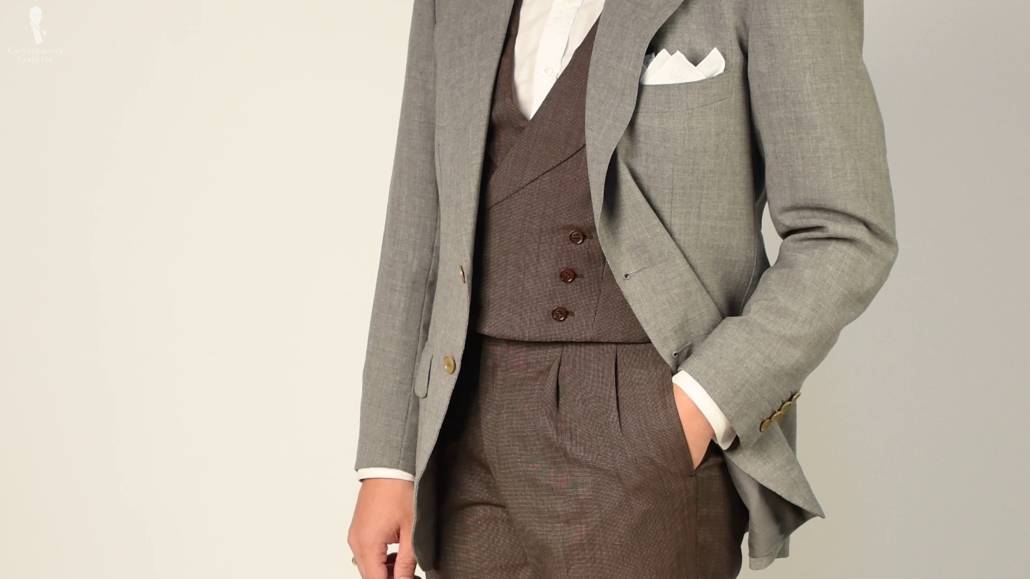 Matching waistcoat and trousers from a three-piece suit paired with a contrasting jacket.