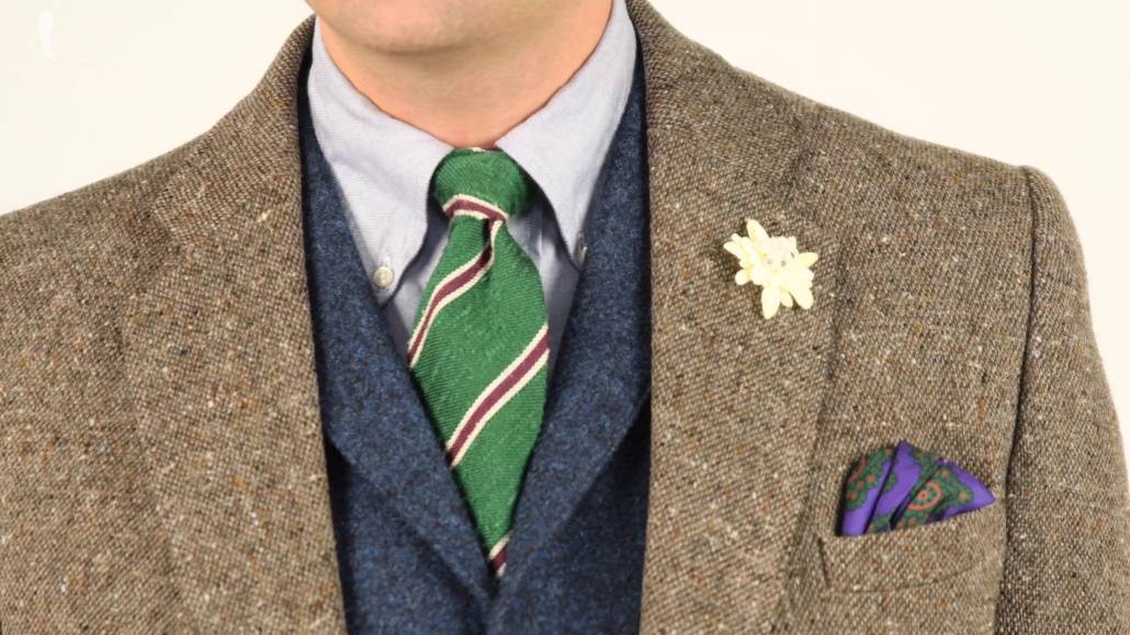 Tweed jacket, blue tweed vest, light blue collared shirt paired with a purple madder silk pocket square and green and purple shantung silk tie