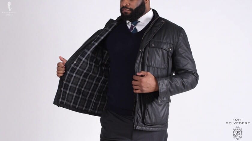 Waxed Cotton Jacket With Vneck Sweater Kyle wearing a dark jacket and sweater