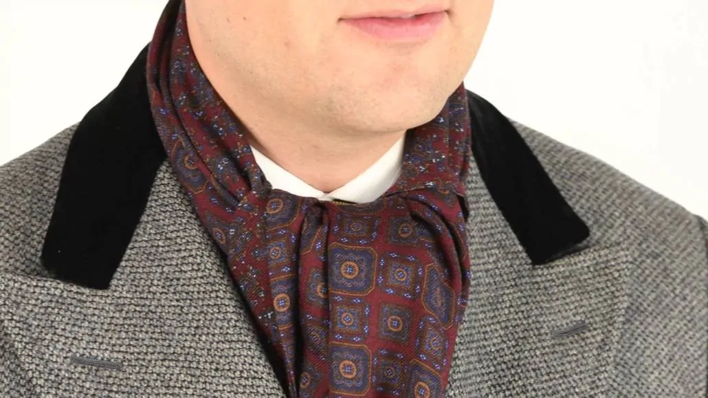 You can pair a gray overcoat with a scarf that has a touch of red. 