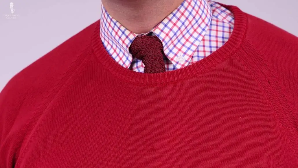 You can also pair a red sweater with a gray odd trousers. 