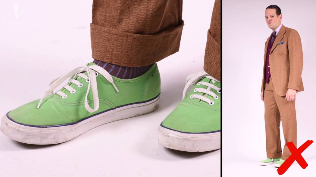 Sneakers And A Suit Wearing a pair of sneakers with a suit looks disharmonious in our estimation.